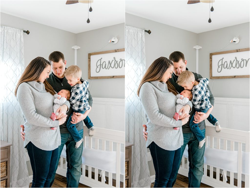 In-Home lifestyle newborn photos of a family in the baby's nursery. Big brother kissing baby's head.
