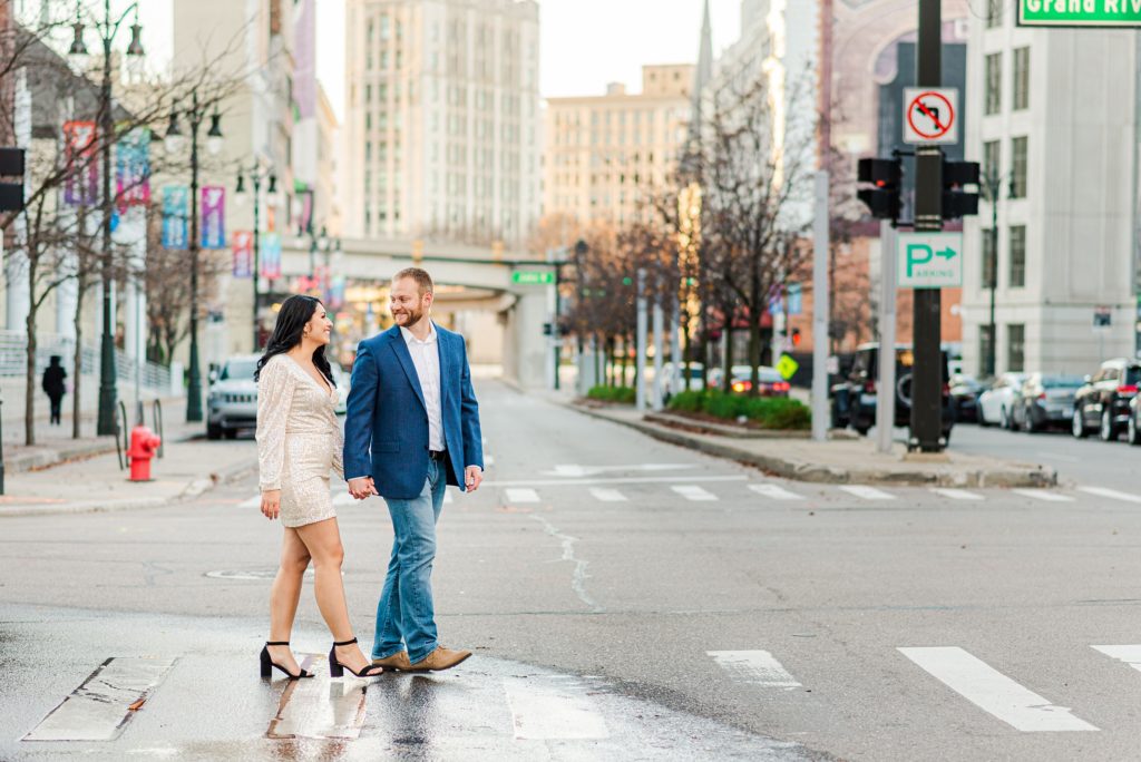 Couple walking while looking at each other in Downtown Detroit. 