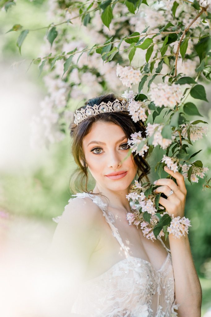 Bride in a lilac bush at Meadowbrook Hall and Gardens
