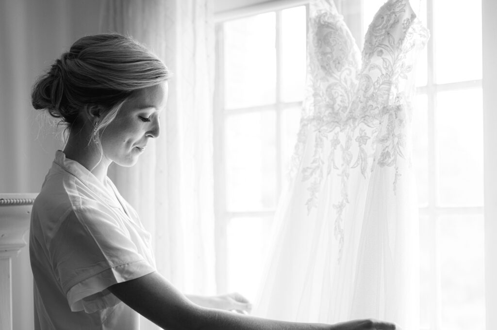 Bride looking at her gown