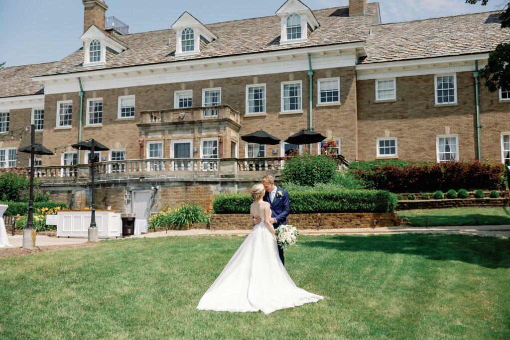 Bride and groom at their wedding in front of Felt Mansion in Saugatuck Michigan
