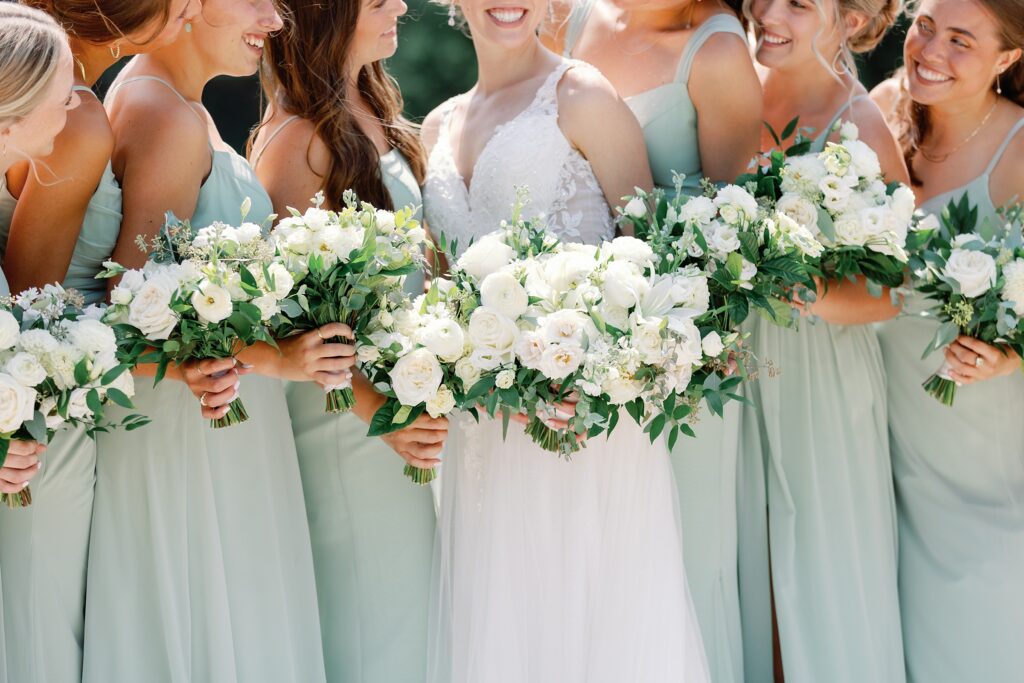 Up close photo of bridal bouquet, greens and whites.