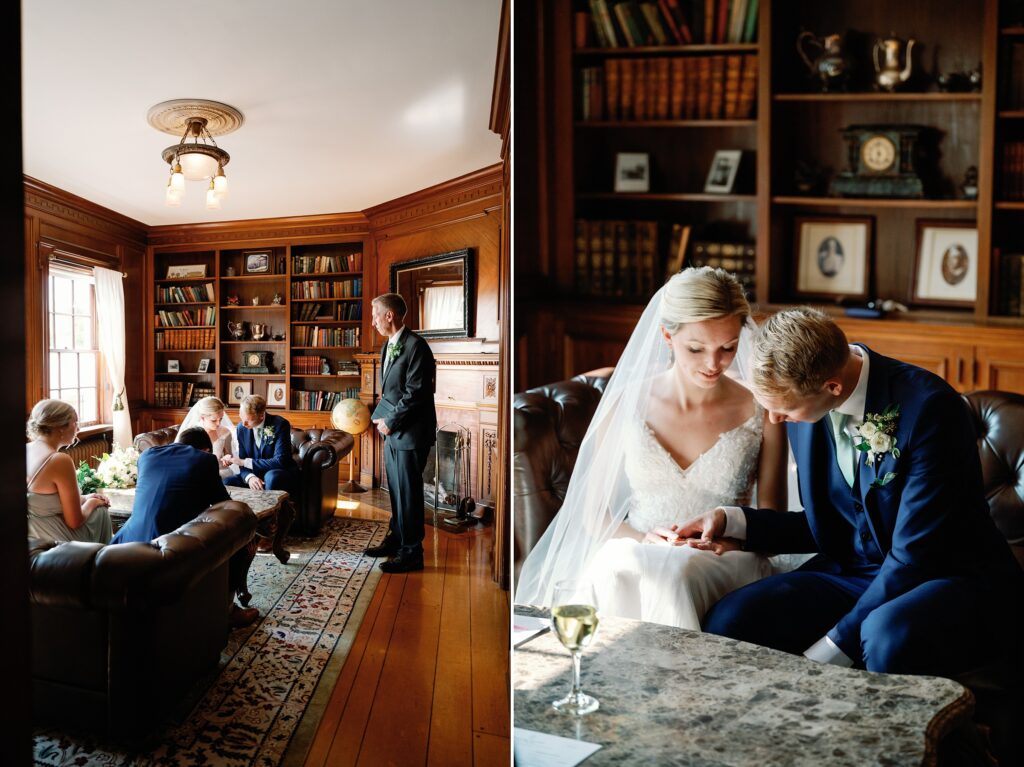 Bride and groom in an old library at the felt mansion, signing their marriage certificate.