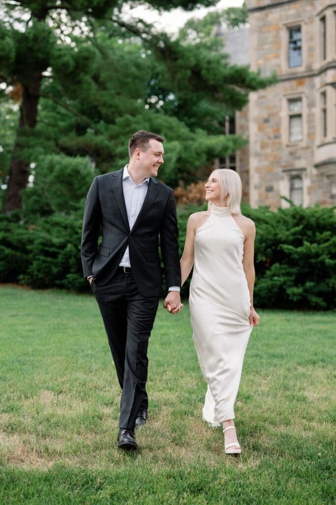 A couple walking together across the lawn at the Law Quad, Ann Arbor